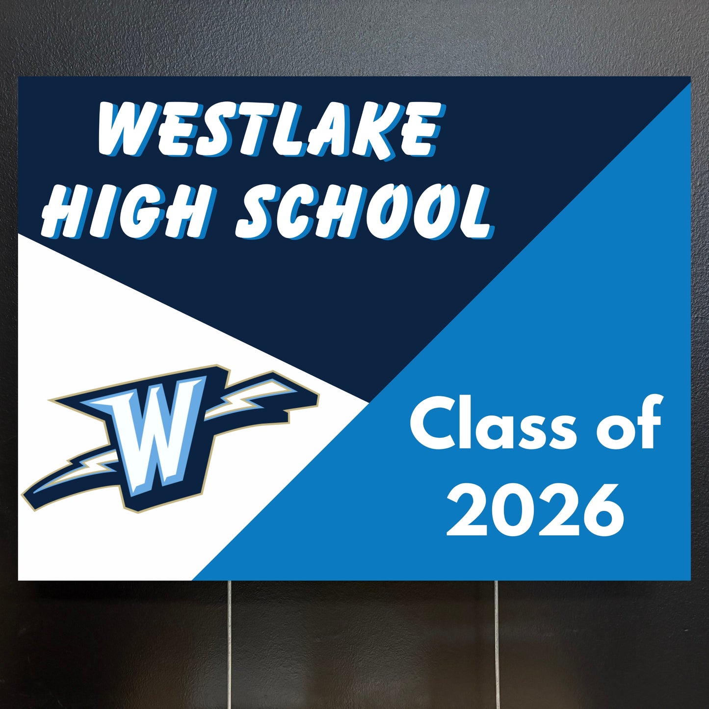 Westlake High School Class of 2026 sign with school logo on a blue and white background