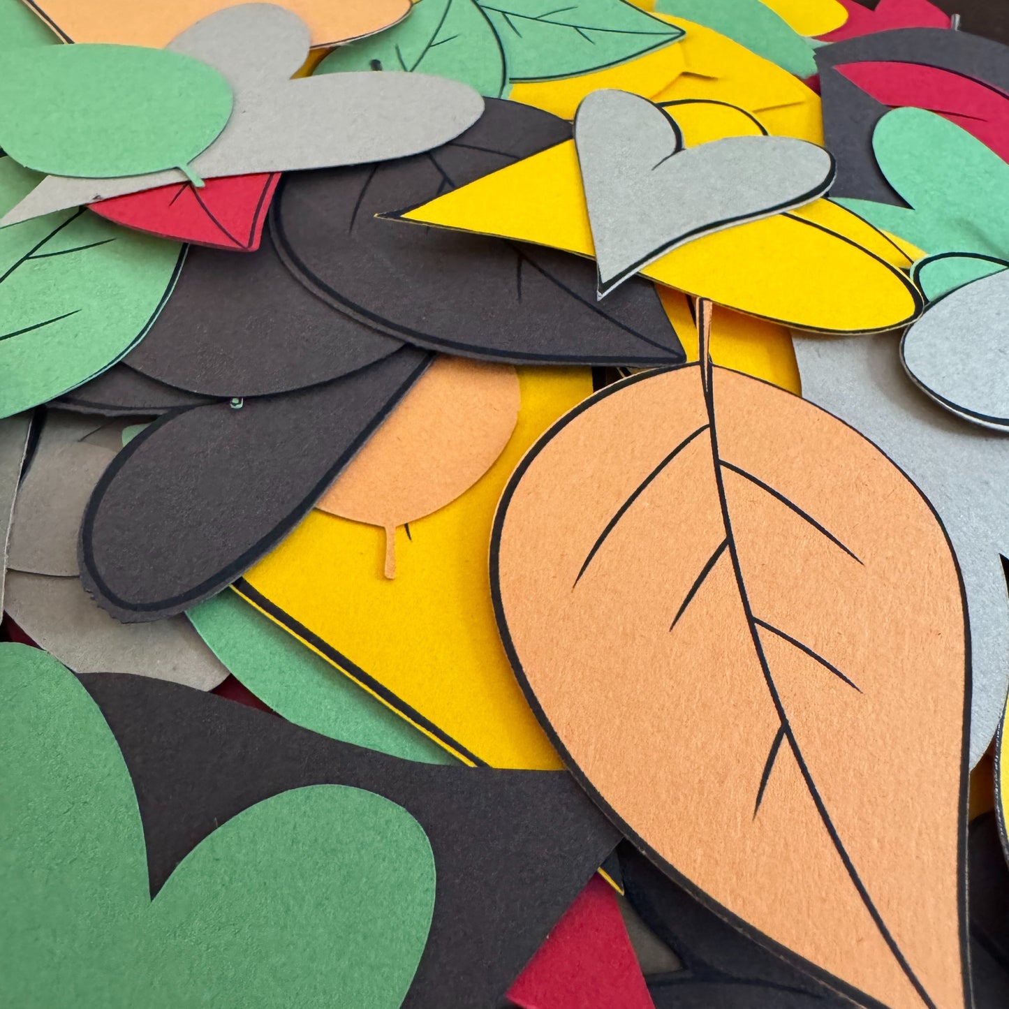 Colorful paper leaves arranged together