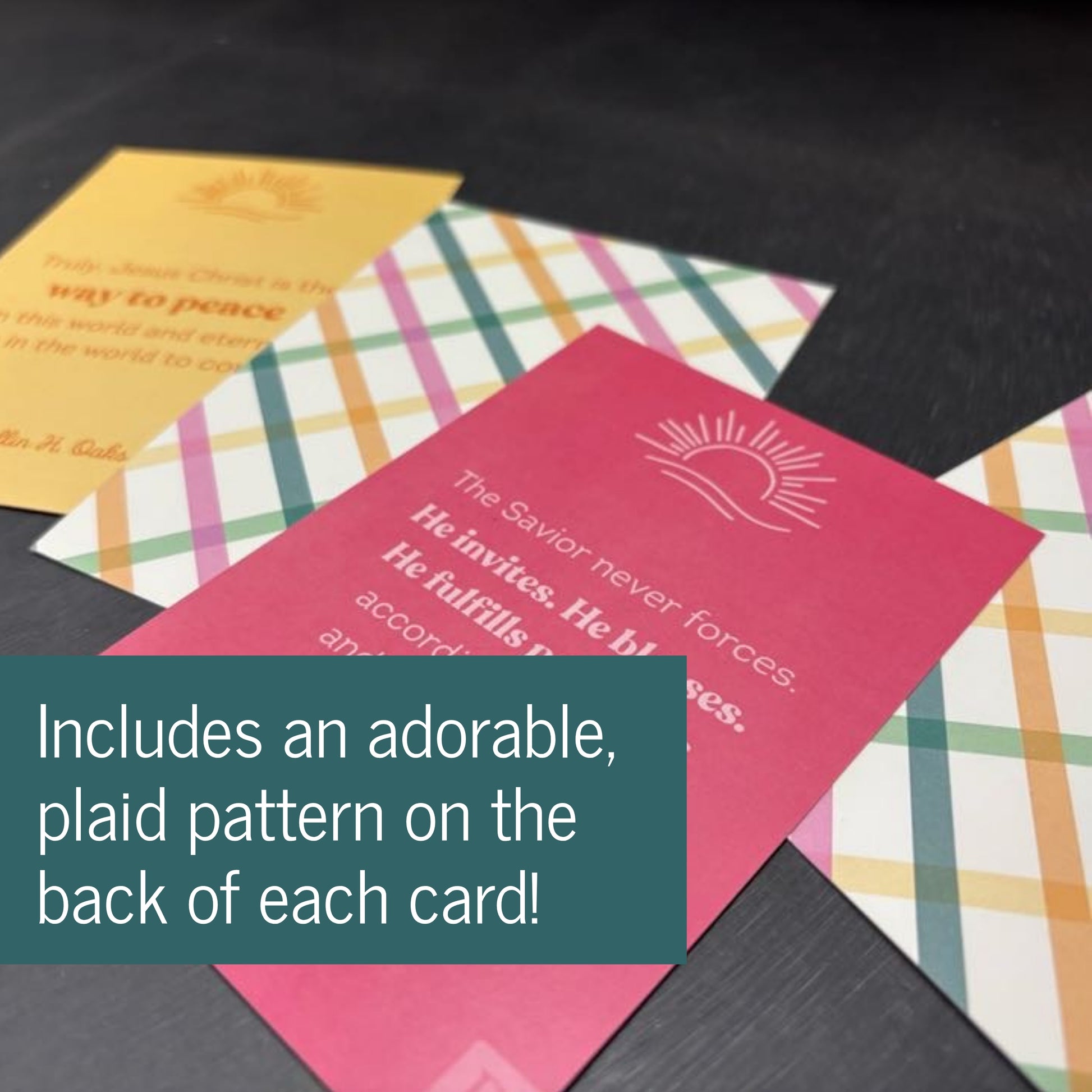 Colorful cards with plaid backs and text on a dark surface