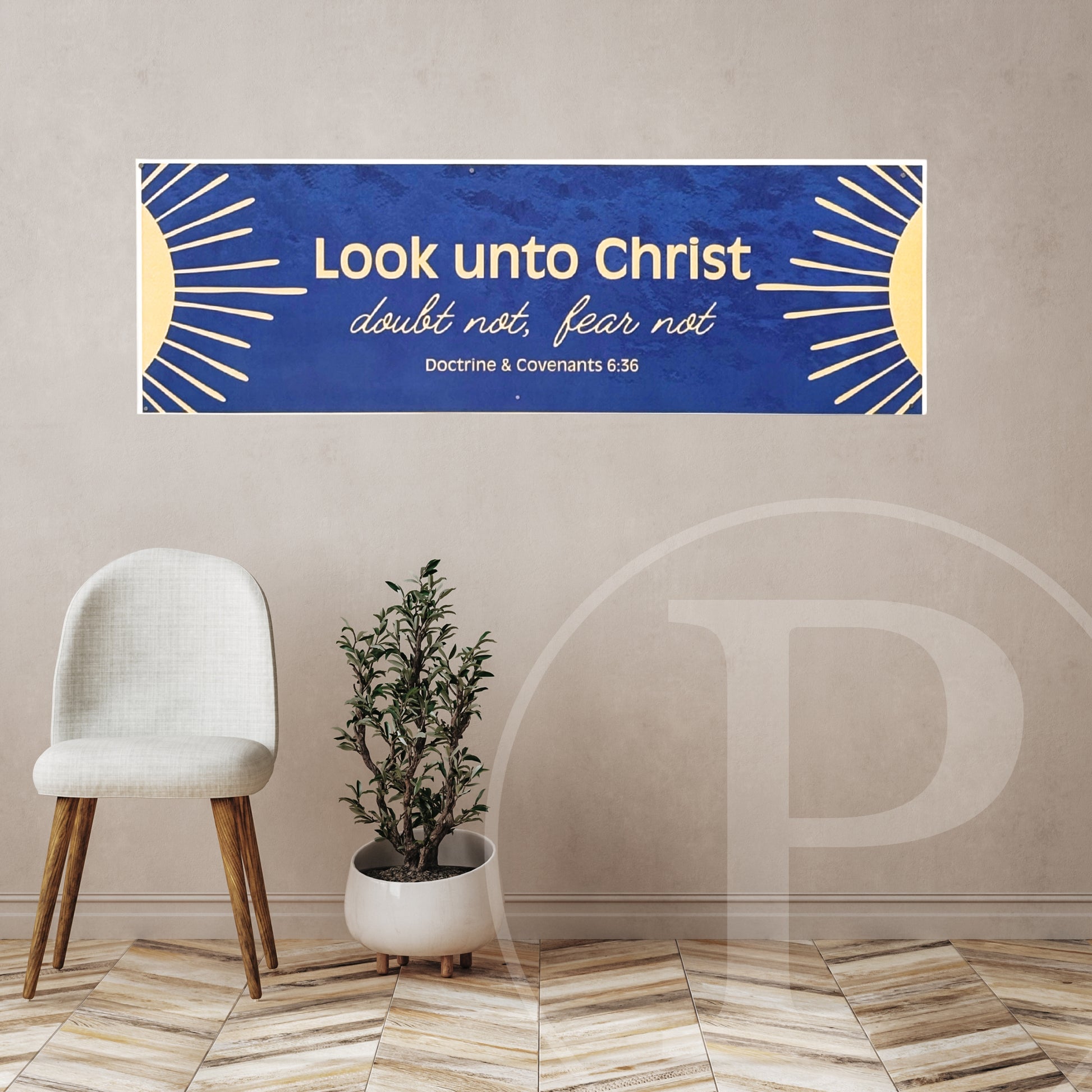 Decorative lds youth banner with 2025 yw/ym theme on a wall above a chair and plant.