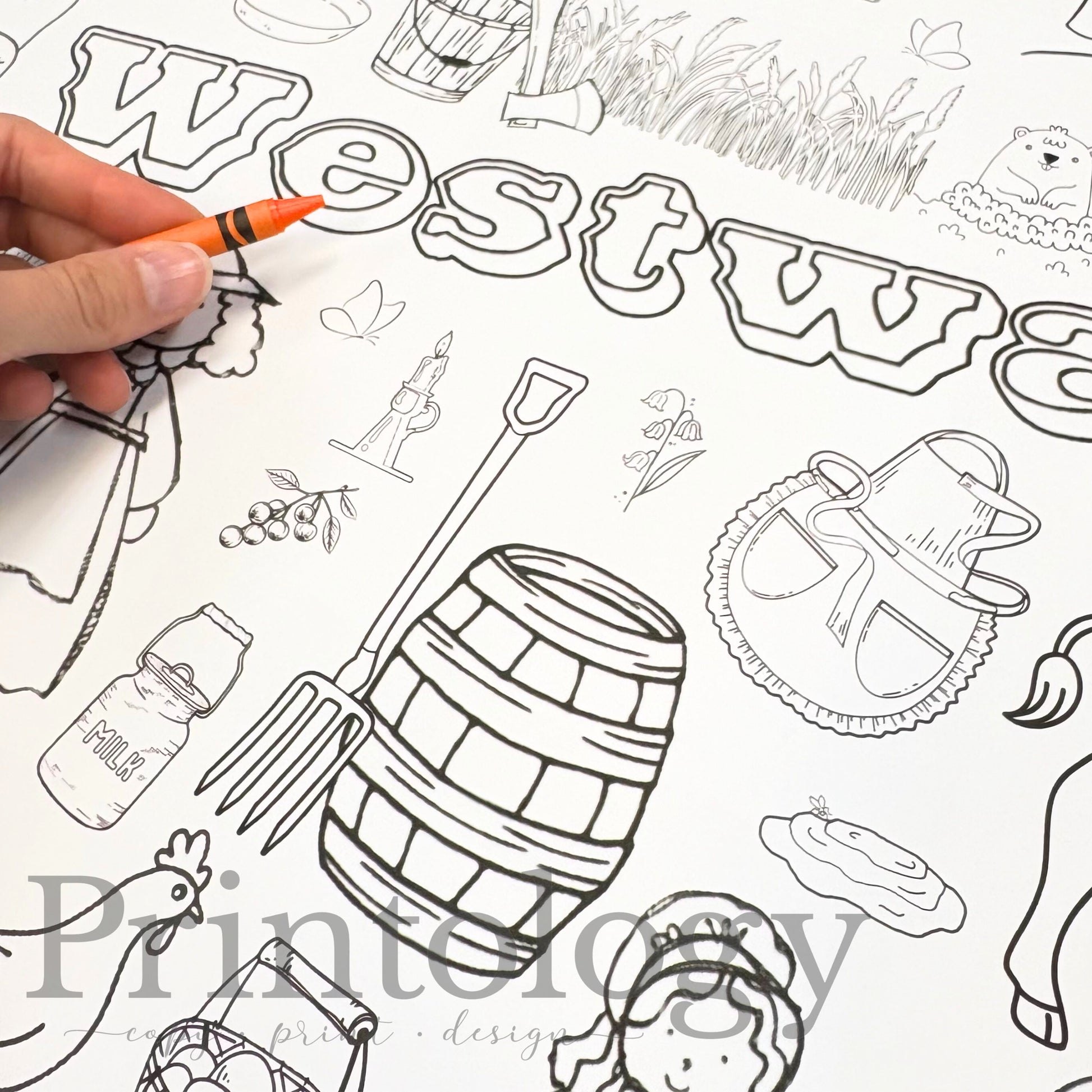 Giant Coloring page with 'Westward' text and various illustrations including a barrel, apron, prairie grass, etc, being colored with a crayon.