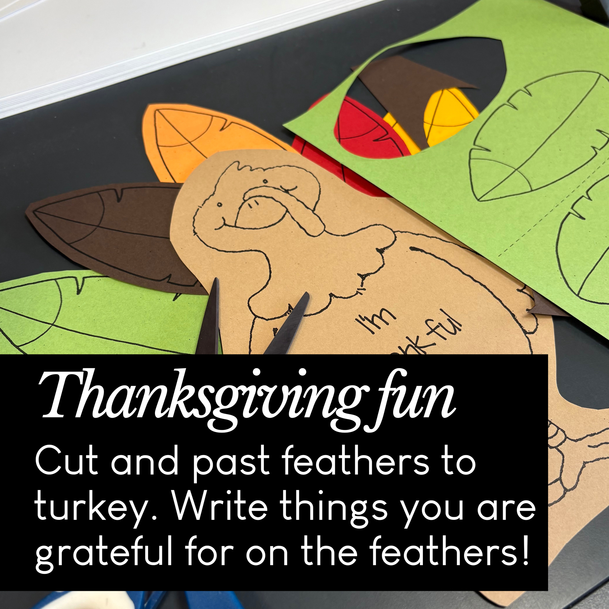 Thanksgiving craft activity with feathers and a turkey cutout on a table.